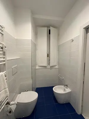 a bathroom with a tub and a sink and a toilet at B&B Una notte a Mazzini in Rome