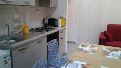 a kitchen with a sink and a stove top oven at MCM in Rome