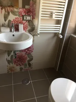 a bathroom with a sink and a toilet at Casa Grimaldi in Rome