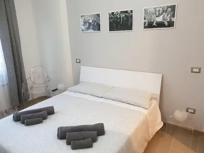 a bedroom with a bed with two pillows on it at Casa Grimaldi in Rome
