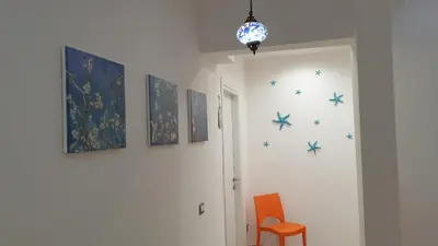 a hallway with blue stars on the wall at Casa Grimaldi in Rome