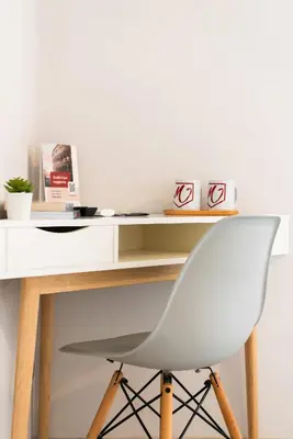 a white desk with a white chair in front of it at Winkler Suites in Rome