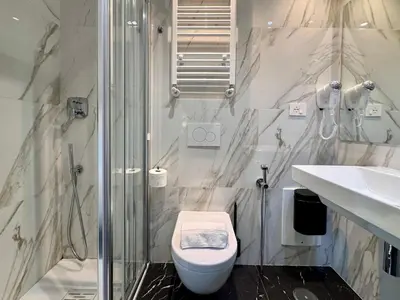 a bathroom with a shower and a toilet and a sink at Room Roma Nazionale in Rome