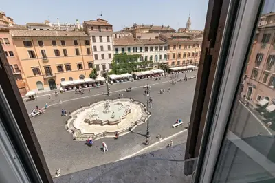 a view of a city square from a window at Presidential Penthouse Navona in Rome