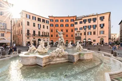 a fountain in the middle of a city at Presidential Penthouse Navona in Rome