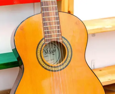 a wooden guitar is sitting on a shelf at Charming Studio near the Colosseum in Rome, 45 m² with Balcony in Rome