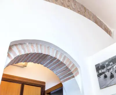 an archway over a door in a house at Charming Studio near the Colosseum in Rome, 45 m² with Balcony in Rome