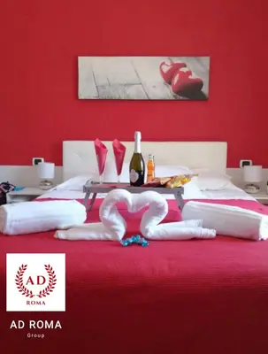 a red bedroom with a bed with a red wall at AD Trastevere Guest House - by AD Roma in Rome