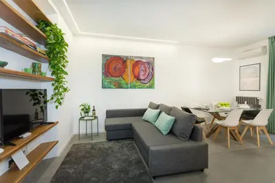 a living room with a couch and a table at Testaccio historic house in Rome