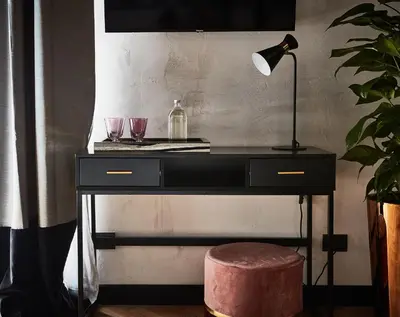 a black desk with two glasses and a lamp at NAMAN HOTELLERIE - Margutta in Rome