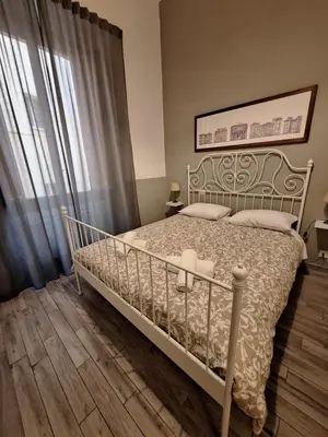 a bedroom with a bed and a window at Vatican Tolemaide 2 in Rome