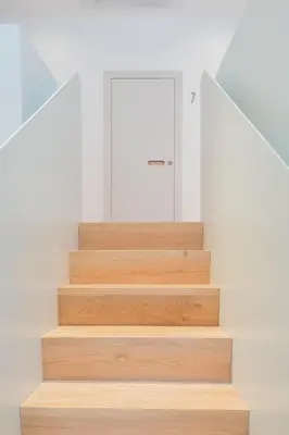 a staircase in a house with wooden steps at The Radical Hotel Roma in Rome