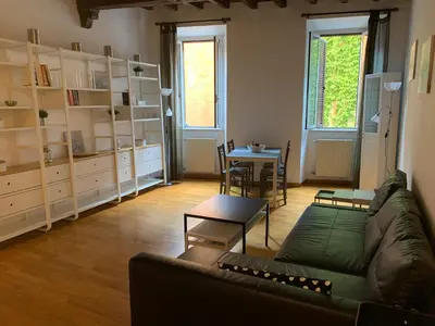 a living room with a couch and a table at Navona Relais - Center of Rome in Rome