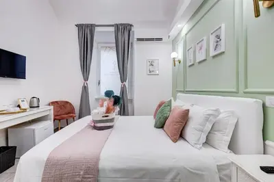 a bedroom with a large white bed with pillows at Maison Risorgimento in Rome
