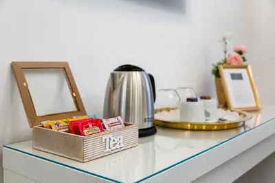 a counter top with a mirror and a tea kettle at Maison Risorgimento in Rome