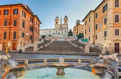 a building with a fountain in the middle of a street at Magenta Collection Terrione 17 in Rome