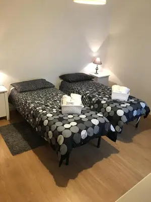 two beds sitting next to each other in a room at Casa Milù in Rome