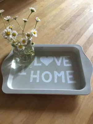 a sign that says i love home with a vase of flowers at Casa Milù in Rome