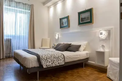 a bedroom with a bed with two pillows on it at Dulcis In Vatican b&b in Rome