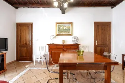 a kitchen with a sink and a stove at Confortevole Appartamento nel Centro Storico con 2 camere AC WiFi in Rome