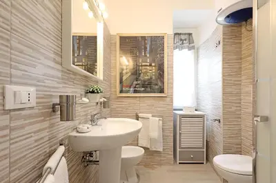 a bathroom with a sink and a toilet at Cave98 Apartment in Rome