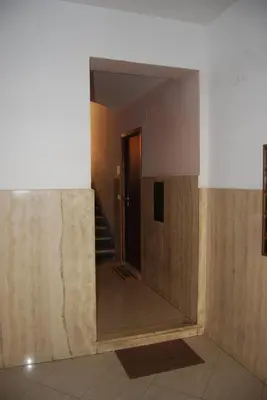 a room with a hallway with a mirror and stairs at Cave98 Apartment in Rome