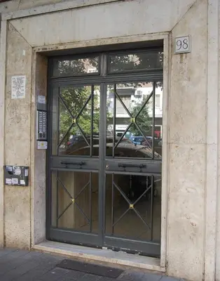 a large glass door of a building at Cave98 Apartment in Rome
