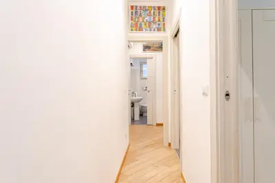 a hallway of a home with a white wall at St. Peter Garden House in Rome