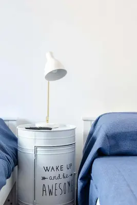 a lamp sitting on top of a can next to a bed at Saint Peters Luxury 3 Bedrooms Apartment in Rome