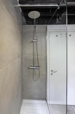 a shower with a glass door in a bathroom at Casa Nora in Rome