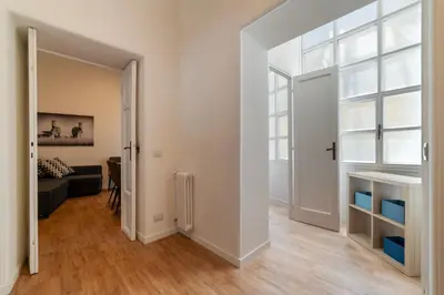 an empty living room with a window and a couch at CS Termini Nazionale Apartments in Rome