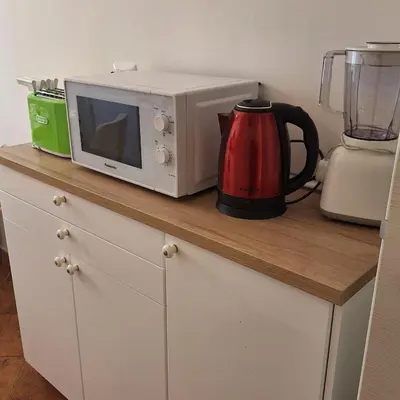 a microwave sitting on top of a kitchen counter at ART APARTMENT VILLA FIORELLI in Rome