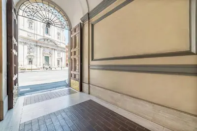 an empty hallway with an entrance to a building at Loft Farnese luxury 3 stanze 3 bagni salotti cucina in Rome