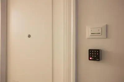a remote control on the wall of a room at Capo Le Case Home 9 in Rome