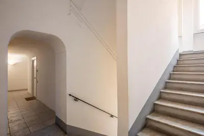 a hallway with stairs and an archway at Capo Le Case Home 9 in Rome
