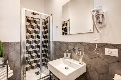 a bathroom with a sink and a shower at Capo Le Case Home 9 in Rome