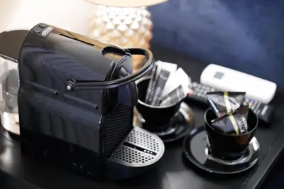a black table with coffee cups and a toaster at HT HOMETOWN VITE in Rome