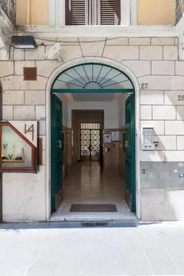 an entrance to a building with a green door at HT HOMETOWN VITE in Rome