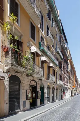 a building with balconies on the side of a street at HT HOMETOWN VITE in Rome
