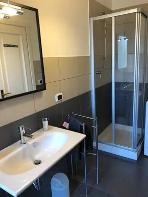 a bathroom with a sink and a shower at Eva's house Roma in Rome