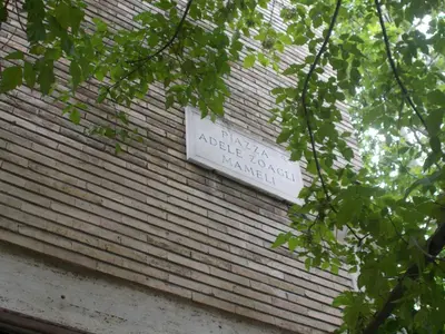 a sign on the side of a brick building at Milla's house rome in Rome