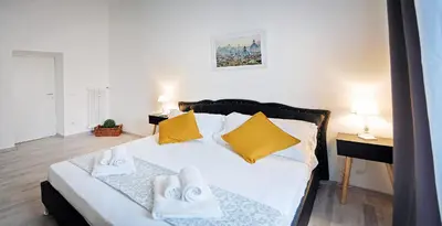 a bedroom with a bed with towels on it at Pompeo Magno White Luxury Apartment in Rome