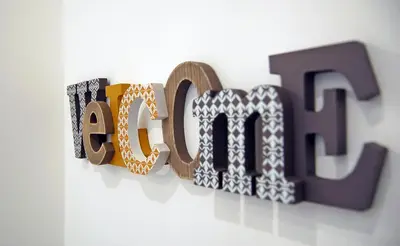 a close up of the word art on a wall at Pompeo Magno White Luxury Apartment in Rome
