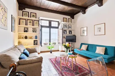a living room with a couch and a table at Rome As You Feel - Cancelli Apartment in Rome