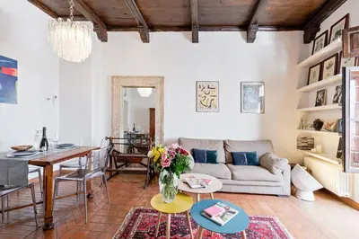 a living room with a couch and a table at Rome As You Feel - Cancelli Apartment in Rome