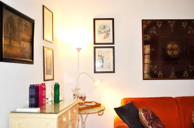 a living room with a couch and a table at Roman Atmospheres in Rome