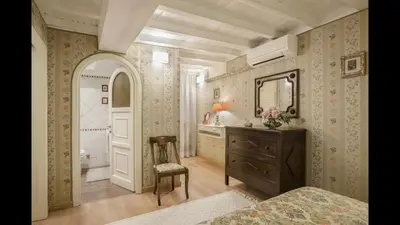 a dining room with a table and a mirror at Panoramic Trevi Fountain View Luxury Apt in Rome