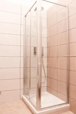 a shower with a glass door in a bathroom at Domus Termini in Rome