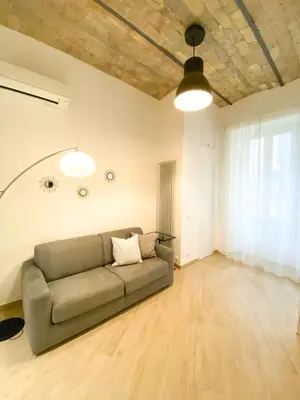 a living room with a couch in the middle at Domus Termini in Rome