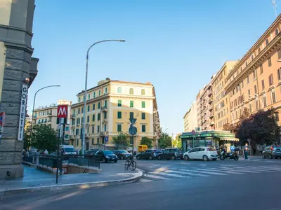 a busy city street with cars parked on the street at The Right Place - Guest House in Rome